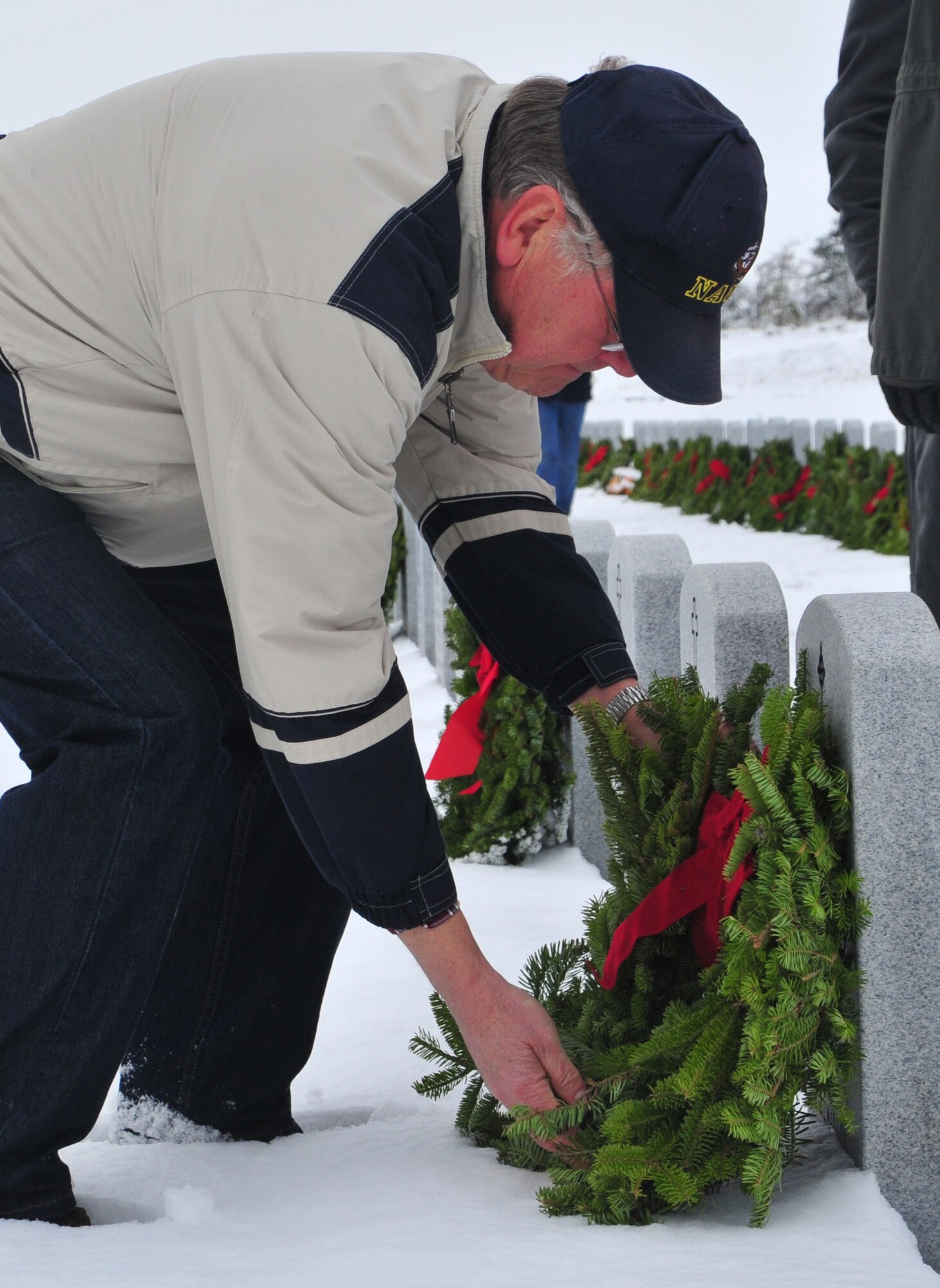 Families and friends of fallen veterans gather to place a wreath upon the burial stone of their loved ones in support of Wreaths Across America at the Washington State Veteran’s Cemetery in Medical Lake, Wash., Dec. 15, 2012. Wreaths Across America, started by Morril Worcester, the owner of a decorative wreath company in Harrington, Maine, expanded to a national level after photos of his donations of wreaths to Arlington Cemetery were circulated in 2005. (U.S. Air Force photo by Airman 1st Class Taylor Curry)