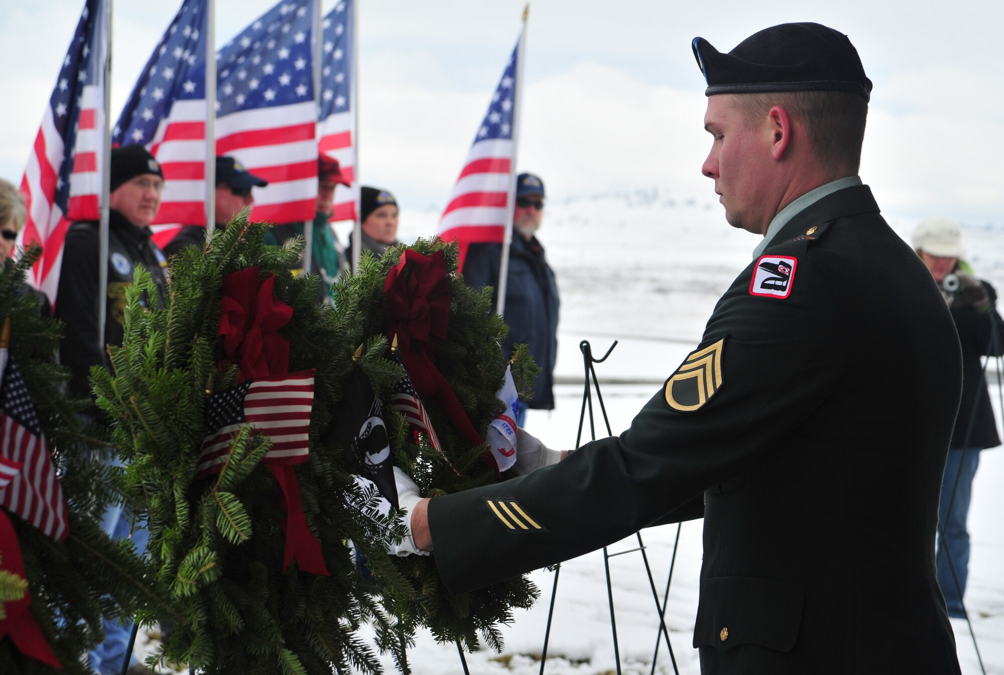 Members from all branches of military place wreaths upon stands in support of Wreaths Across America at the Washington State Veteran’s Cemetery in Medical Lake, Wash., Dec. 15, 2012. Wreaths Across America’s goal is to get people to remember the men and women who served our country, honor our military and their families, and teach children about our freedom and those who protect it. (U.S. Air Force photo by Airman 1st Class Taylor Curry)