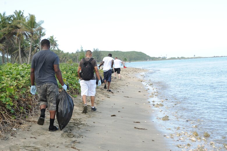 Weapons personnel from the 36th Maintenance Squadron participate in a beach cleanup at Asan Beach, Guam, Dec. 7, 2012, as part of their Weapons Day of Caring. The cleanup was organized in remembrance of the attacks on Pearl Harbor Dec. 7, 1941. (U.S. Air  Force photo by Airman 1st Class Adarius Petty/Released)