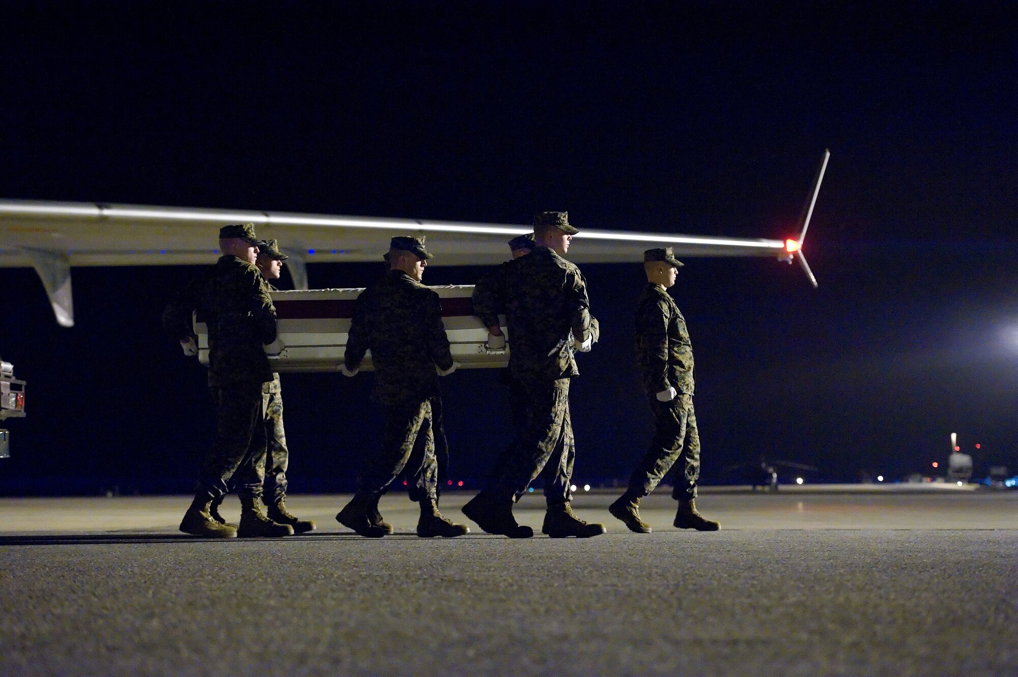 A U.S. Marine Corps carry team transfers the remains of Sgt. Michael J. Guillory, 28, of Slidell, La., at Dover AFB, Del., Dec. 15, 2012. Guillory was assigned to 1st Marine Special Operations Battalion, Camp Pendleton, Calif. (U.S. Air Force photo/Greg L. Davis)
