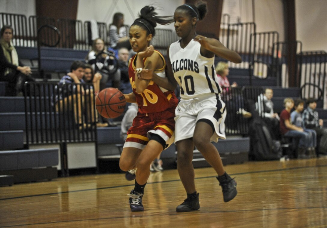 Marquis, Quantico Middle/High School Lady Warriors’ Basketball Team player, attempts a fast break during a game against last year’s champions, the Fredericksburg Academy Falcons, in Fredericksburg on Dec. 13.(U.S. Marine Corps photo by Lance Cpl. Antwaun L. Jefferson/Released)