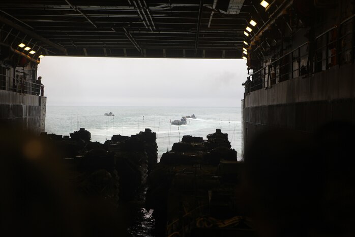 USS NEW YORK off the coast of North Carolina – Assault Amphibious Vehicles from Battalion Landing Team 1st Battalion, 2nd Marine Regiment, 24th Marine Expeditionary Unit, disembark the USS New York on their home base at Camp Lejeune, N.C. Dec. 16, 2012. Approximately 2,300 Marines and Sailors with the 24th MEU returned to the U.S. after being deployed for nine months as an expeditionary crisis response force with the Iwo Jima Amphibious Ready Group. They offloaded from the amphibious assault ships USS Iwo Jima, USS New York and USS Gunston Hall using amphibious vehicles, aircraft, and the Morehead City Port facility. (U.S. Marine Corps photo by Cpl. Michael Petersheim)