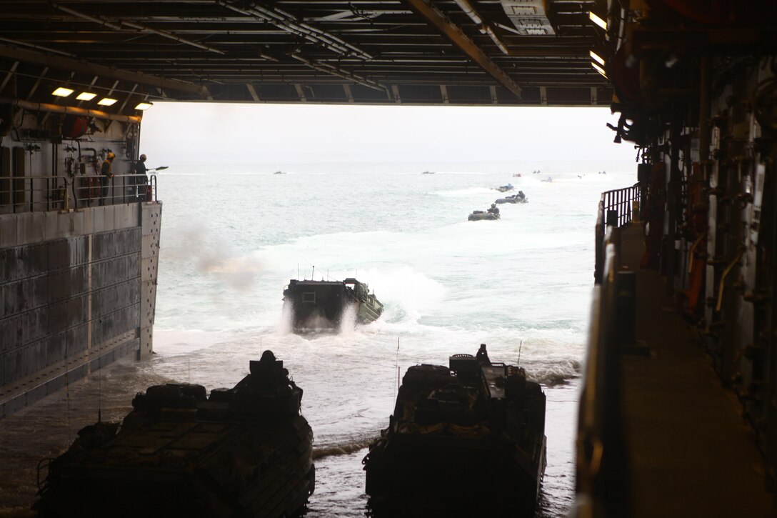 USS NEW YORK, off the coast of North Carolina – Assault Amphibious Vehicles from Battalion Landing Team 1st Battalion, 2nd Marine Regiment, 24th Marine Expeditionary Unit, disembark the USS New York on their home base at Camp Lejeune, N.C. Dec. 16, 2012. Approximately 2,300 Marines and Sailors with the 24th MEU returned to the U.S. after being deployed for nine months as an expeditionary crisis response force with the Iwo Jima Amphibious Ready Group. They offloaded from the amphibious assault ships USS Iwo Jima, USS New York and USS Gunston Hall using amphibious vehicles, aircraft, and the Morehead City Port facility. (U.S. Marine Corps photo by Cpl. Michael Petersheim)