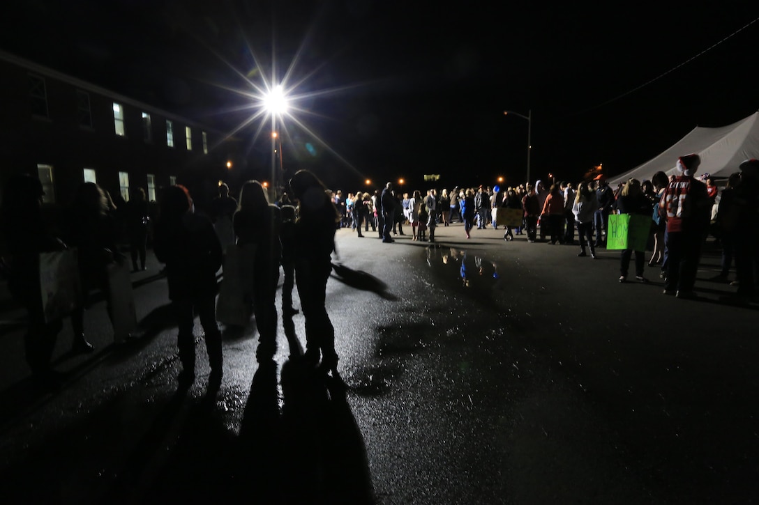 MARINE CORPS BASE CAMP LEJEUNE, N.C. – Friends and family members wait patiently for Marines and Sailors with the 24th Marine Expeditionary Unit to return home from deployment on Camp Lejeune, Dec. 16, 2012. The 24th Marine Expeditionary Unit has returned to the U.S. after completing nearly nine months deployed as an expeditionary crisis response force with the Iwo Jima Amphibious Ready Group.   Approximately 2,300 Marines and Sailors of the 24th MEU will be offloading over the next few days from amphibious assault ships USS Iwo Jima, USS New York and USS Gunston Hall. (Official U.S. Marine Corps Photo by Sgt. Richard Blumenstein)