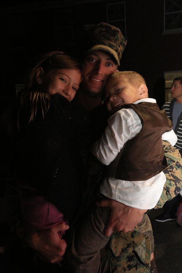 MARINE CORPS BASE CAMP LEJEUNE, N.C. – Staff Sgt. Patrick Hammer, an infantry platoon sergeant with Charlie Company, Battalion Landing Team 1st Battalion, 2nd Marine Regiment, 24th Marine Expeditionary Unit embraces his family after returning home from deployment on Camp Lejeune, Dec. 16, 2012. The 24th Marine Expeditionary Unit has returned to the U.S. after completing nearly nine months deployed as an expeditionary crisis response force with the Iwo Jima Amphibious Ready Group.   Approximately 2,300 Marines and Sailors of the 24th MEU will be offloading over the next few days from amphibious assault ships USS Iwo Jima, USS New York and USS Gunston Hall. (Official U.S. Marine Corps Photo by Sgt. Richard Blumenstein)