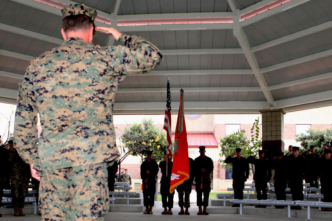 Brig. Gen. John J. Broadmeadow, incoming commanding officer of 1st Marine Expeditionary Brigade, salutes the unit’s colors during a change-of-command ceremony at Camp Pendleton, Dec. 13. During the ceremony, Spiese passed the unit’s colors to Broadmeadow symbolizing the transfer of responsibility, authority and accountability of command from one officer to another. The 1st MEB, which was reactivated October 2009, is a task-organized crisis response force of I Marine Expeditionary Force trained to respond expeditiously to conduct self-sustained combat and humanitarian operations.