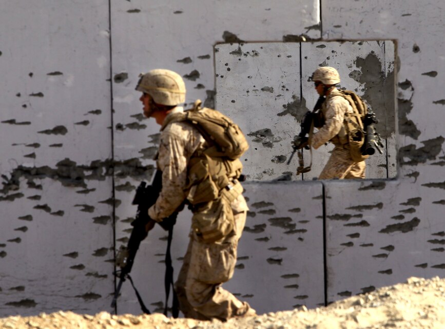 Marines with Company C, 2nd Battalion, 4th Marine Regiment, run through Range 210 Dec. 11, 2012, during Steel Knight 13. 