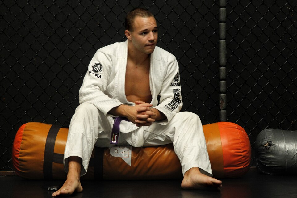 Ian Lawler looks over his students as they perform exercises during his Brazilian Jiu Jitsu class at Neo Warrior MMA N’ Boxing Gym. Lawler, a hospital corpsman at Rober E. Bush Naval Hospital, volunteers his time to teach mixed martial arts before and after work three days a week. He is a purple belt in Brazilian Jui Jitsu.