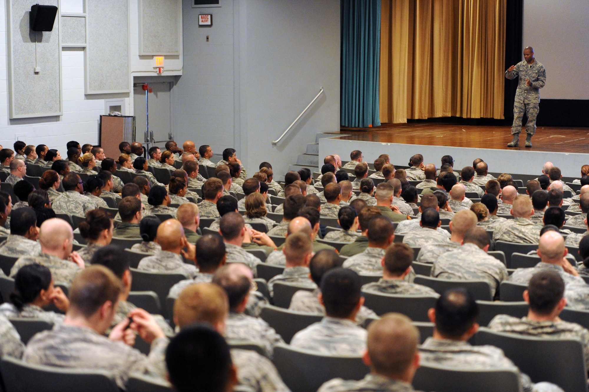 Chief Master Sgt. Les Bramlett, 15th Wing command chief, answers questions from Airmen during an enlisted call at the base theater Dec. 13 at Joint Base Pearl Harbor-Hickam, Hawaii. During the call, Bramlett discussed various topics including the five 15th WG priorities: execute the mission, ensure readiness, develop our Airmen, grow resilient Airmen and families, and strengthen partnerships. (U.S. Air Force photo by Staff Sgt. Nathan Allen)