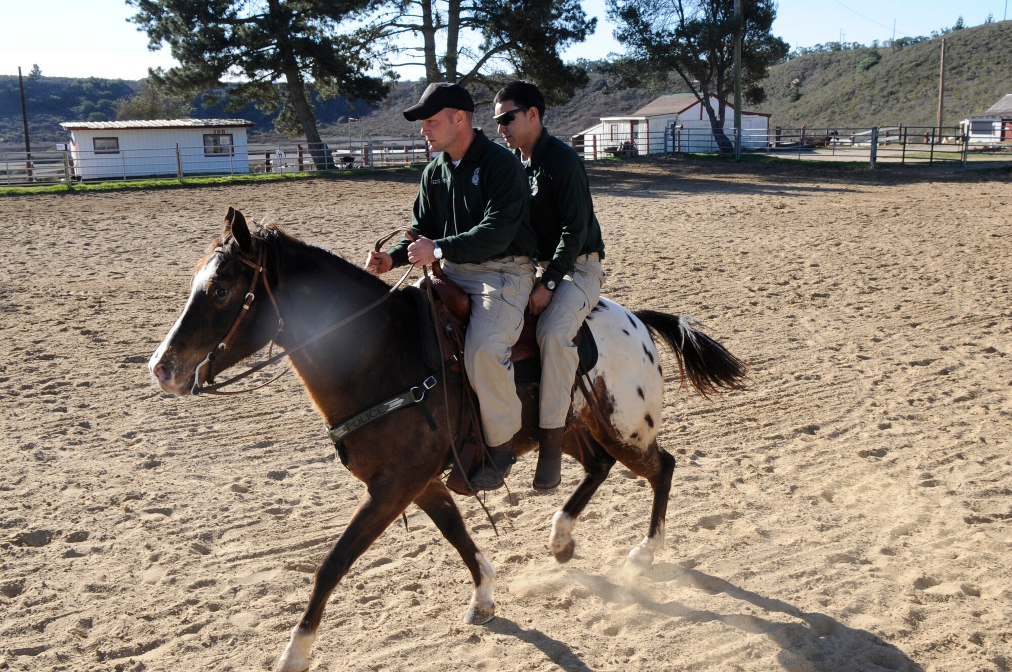 VANDENBERG AIR FORCE BASE, Calif. - Tech. Sgt. Sean Yargus, a 30th Security Forces Squadron conservation officer, and his horse, Gunner, performs a lunging training session here Friday, Jan. 13, 2012. When lunging a horse, the handler can watch him from the ground to monitor his movement, soundness and natural frame. Yargus is the NCO in charge of the only Mounted Horse Patrol unit in the entire Air Force.  (U.S. Air Force photo/Tech. Sgt. Scottie T. McCord)