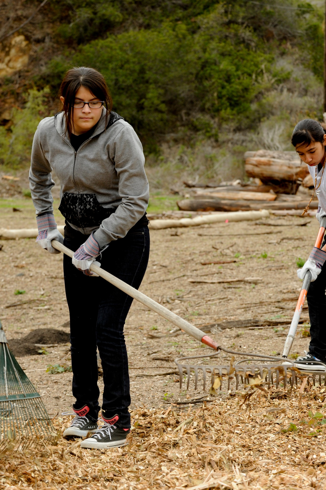 VANDENBERG AIR FORCE BASE, Calif. -- Mariah Jeff, a Bakersfield High School Air Force Junior Reserve Officers' Training Corps cadet, spreads mulch at Honda Creek on South base here Friday, Dec. 14, 2012. The cadets came to Vandenberg to provide community service to the installation as part of their duties in JROTC. (U.S. Air Force photo/Staff Sgt. Levi Riendeau)