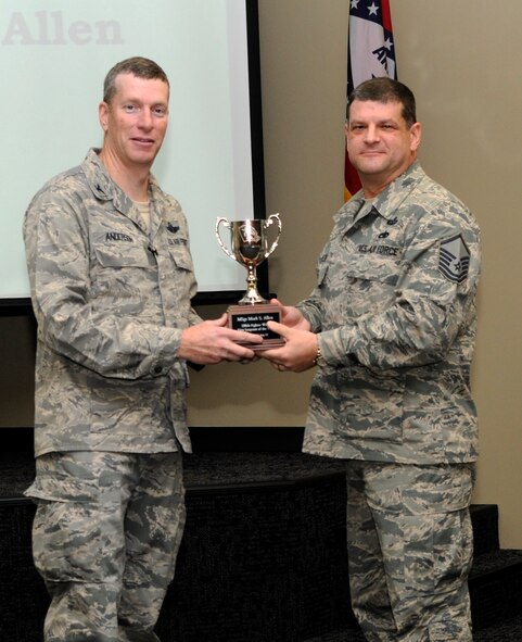 Col. Mark Anderson, 188th Fighter Wing commander, left, poses for a photo with Outstanding First Sergeant of the Year, Master Sgt. Mark S. Allen, during a commander’s call Dec. 1 at the 188th. (National Guard photo by Amn Cody Martin/188th Fighter Wing Public Affairs)
