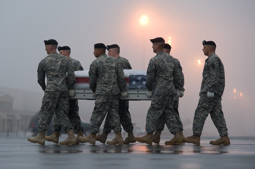 A U.S. Army carry team transfers the remains of Sgt. 1st Class Kevin E. Lipari, 39, of Baldwin, N.Y., at Dover AFB, Del., Dec. 17, 2012. Lipari was assigned to HHC 173rd Airborne Brigade Combat Team, Bamberg, Germany. (U.S. Air Force photo/Greg L. Davis)
