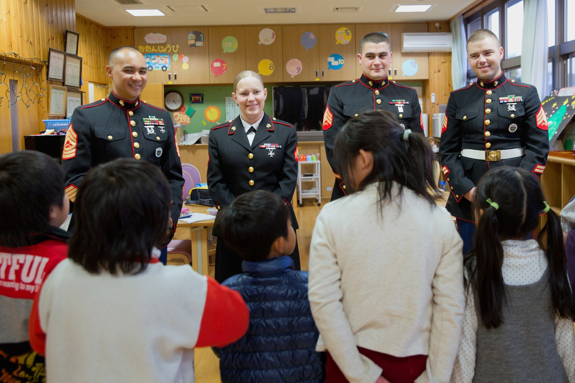 AKIRUNO CITY, Japan -- Children greet members from U.S. Marine Corps at Ajiro orphanage in Akiruno city, Tokyo, Dec. 14, 2012 during the annual Toys for Tots drive. Toys for Tots is a U.S. Marine Corps Reserve program to collect new, unwrapped toys during October, November, and December each year. Those toys are distributed as Christmas gift to needy children in the community. Marines at Yokota Air Base, Japan, distributed toys to children at local orphanages surrounding the base. (U.S. Air Force photo by Osakabe Yasuo)
