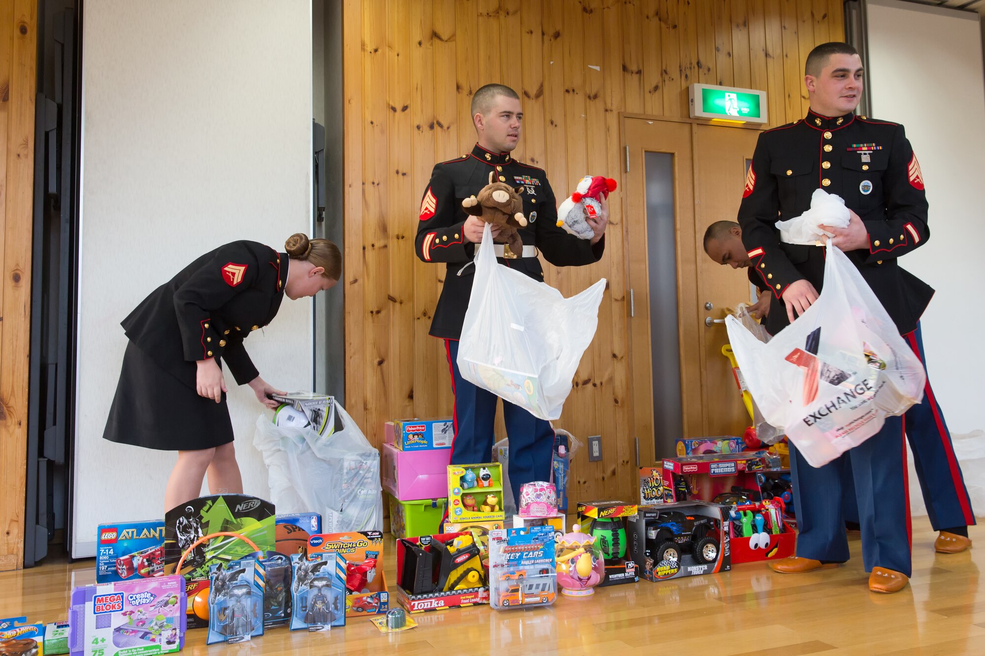 AKIRUNO CITY, Japan -- Members from the U.S. Marine Corps stationed at Yokota Air Base, Japan, prepare toys to be handed out as Christmas gifts at Ajiro orphanage in Akiruno city, Tokyo, Dec. 14, 2012 during the annual USMC Reserve Toys for Tots drive. Every year between October and December, the USMC Reserve program collects new, unwrapped toys for the Toys for Tots program. Those toys are distributed as Christmas gifts to needy children in the community. (U.S. Air Force photo by Osakabe Yasuo)