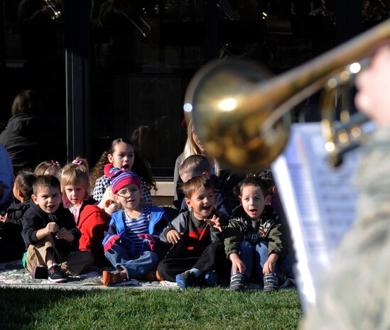 Children from listen to holiday songs performed by Travis Brass at the Child Development Center, Beale Air Force Base Calif., Dec. 13 2012. The ensemble is a part of the Band of the Golden West based at Travis Air Force Base. (U.S. Air Force photo by Staff Sgt. Robert M. Trujillo/Released)