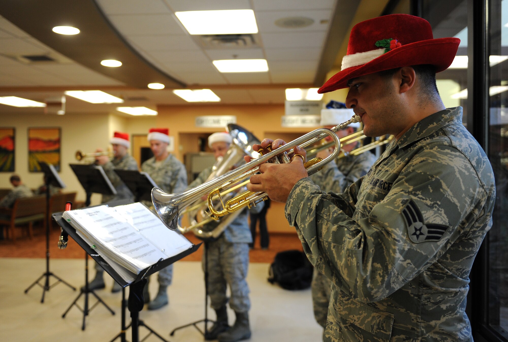 Members of Travis Brass perform Christmas songs for Team Beale at the base clinic, Dec. 13, 2012. The band performs multiple holiday shows across the Western states. (U.S. Air Force photo by Staff Sgt. Robert M. Trujillo/Released)