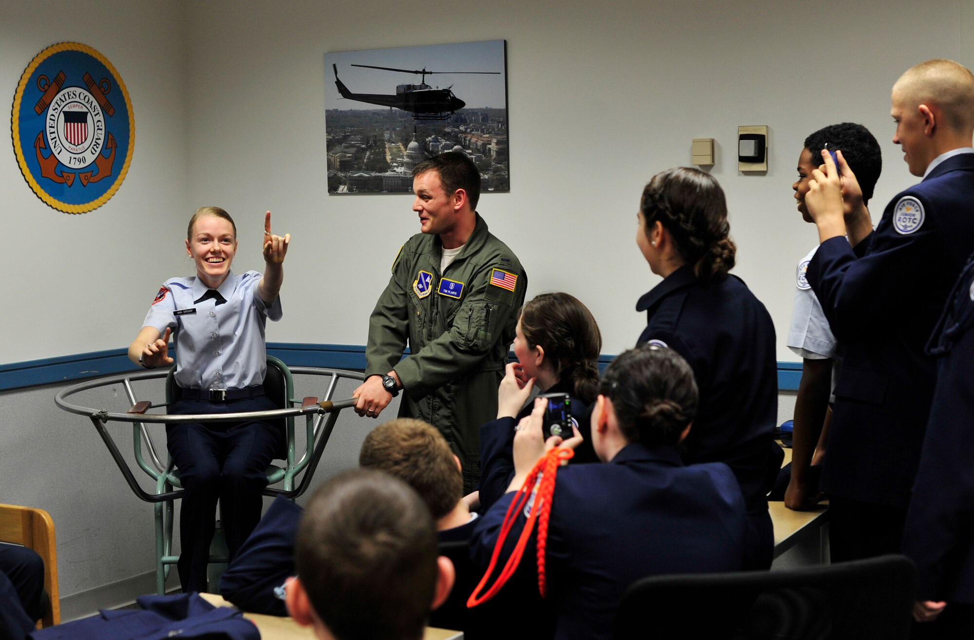 Emily Van Opdorpa North Stafford High School, Air Force Junior ROTC member, experiences the effects of the barany chair at the Aerospace and Operational Physiology Flight Training center, Dec. 14, 2012. The students were asked to perform various tasks while the chair was stopped and in-motion to demonstrate spatial disorientation. (U.S. Air Force photo/ Airman 1st Class Erin O’Shea) 