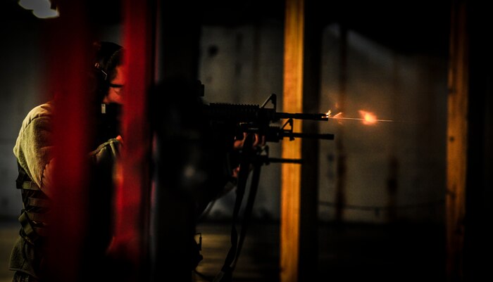 Senior Airman Dustin Turner, 628th Security Forces Squadron patrolman, fires an M-4 carbine in the standing position during a qualifying session at the Combat Arms Training and Maintenance firing range, Dec. 12, 2012, on Joint Base Charleston – Air Base, S.C.  Airmen from the 628th SFS participated in the M-4 training overseen by CATM instructors. (U.S. Air Force photo/ Senior Airman Dennis Sloan)