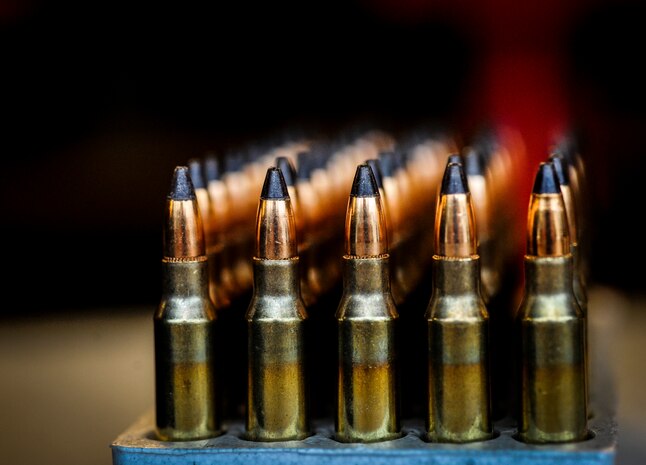 5.56 millimeter rounds are lined up in a shell case for an M-4 carbine qualifying session Dec. 12, 2012, at the Combat Arms Training and Maintenance firing range on Joint Base Charleston – Air Base, S.C.  Airmen load the rounds in a magazine to be fired at a target sheet set up at a certain distance down the firing range. (U.S. Air Force photo/ Senior Airman Dennis Sloan)