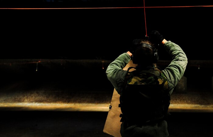Senior Airman Dustin Turner, 628th Security Forces Squadron patrolman, hangs his target sheet downrange before performing the M-4 carbine qualifying course Dec. 12, 2012, at the Combat Arms Training and Maintenance firing range on Joint Base Charleston – Air Base, S.C.  Airmen from the 628th SFS participated in the M-4 training overseen by CATM instructors. (U.S. Air Force photo/ Senior Airman Dennis Sloan)