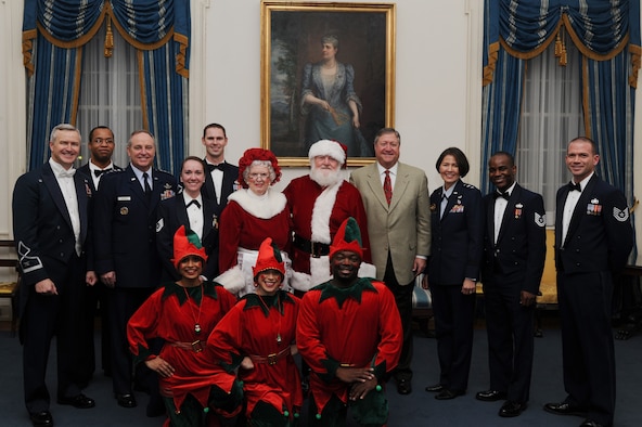 Secretary of the Air Force Michael Donley, Air Force Chief of Staff Gen. Mark A. Welsh III, and Air Force District of Washington Commander Maj. Gen. Sharon K.G. Dunbar pose with U.S. Air Force Band Commander Col. Larry Lang, U.S. Air Force Band members, Mr. and Mrs. Santa Claus and elves after the U.S. Air Force Band 2012 Holiday Concert at DAR Constitution Hall, Washington, D.C., Dec. 9. (U.S. Air Force photo/Airman 1st Class Aaron Stout)