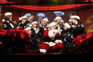 The U.S. Air Force Band Singing Sergeants sing to Santa Claus during the 2012 Holiday Concert at DAR Constitution Hall, Washington, D.C., Dec. Twenty professional Airmen vocalists comprise the Singing Sergeants official chorus. (U.S. Air Force photo/Airman 1st Class Aaron Stout)