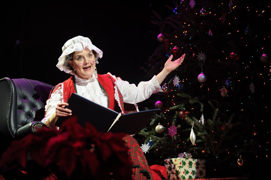 Chief Master Sgt. Jennifer Pagnard, U.S. Air Force Band member, reads "Twas the Night Before Christmas" during the 2012 Holiday Concert at DAR Constitution Hall, Washington, D.C., Dec. 9. The concert was free of charge and open to the general public. (U.S. Air Force photo/Airman 1st Class Aaron Stout)