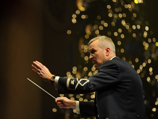Col. Larry H. Lang, U.S. Air Force Band commander, conducts a musical selection during the U.S. Air Force Band 2012 Holiday concert at DAR Constitution Hall, Washington, D.C., Dec. 9. This year's theme offered holiday music inspired by the "Spirit of the Season." (U.S. Air Force photo/Airman 1st Class Aaron Stout)