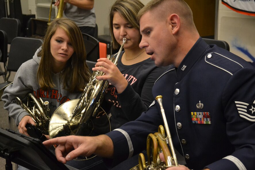 Tech. Sgt. Ryan Miles, horn section leader, Band of the U.S Air Force Reserve interacts with North Cobb High School Band students during a music clinic on Dec. 12, 2012. The clinic provided students with different performance and delivery techniques, ways to listen while rehearsing a piece in a small group, and the requirements for being an Air Force musician. (U.S. Air Force photo/Chandra Brown)