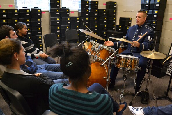 Tech. Sgt. David Vittetoe, percussionist, Band of the U.S. Air Force Reserve, speaks to North Cobb High School Band students on ways to better their skills when playing percussion during a music clinic on Dec. 12, 2012. The clinic provided students with different performance and delivery techniques, ways to listen while rehearsing a piece in a small group, and the requirements for being an Air Force musician. (U.S. Air Force photo/Chandra Brown)
