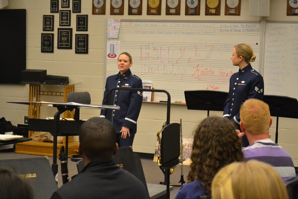 Senior Airman Mary Gant and Senior Airman Kelly Fussell speak to North Cobb High School Band students about their experiences as a musician in the military during a music clinic Dec. 12, 2012. The clinic provided students with different performance and delivery techniques, ways to listen while rehearsing a piece in a small group, and the requirements for being an Air Force musician. (U.S. Air Force photo/Chandra Brown))