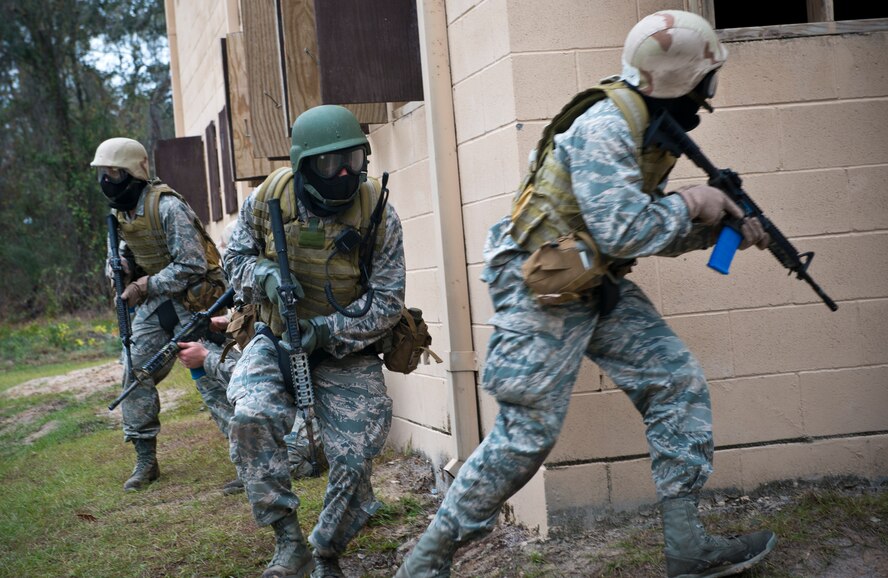 U.S. Air Force ROTC Cadets from multiple universities including Louisiana State University, University of Nevada, Las Vegas and the University of Oklahoma, move through the military operations in urban terrain training village at Moody Air Force Base, Ga., Dec. 13, 2012.The candidates’ mission involved clearing buildings and eliminating opposing forces. (U.S. Air Force photo by Senior Airman Douglas Ellis/Released)
