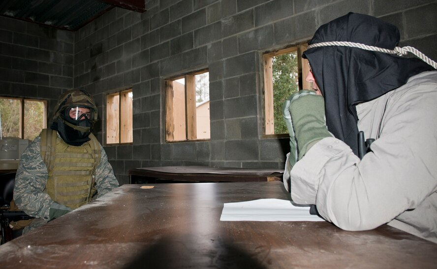 A U.S. Air Force ROTC Cadet interrogates a village leader during an Air Liaison Officer Aptitude Assessment course at Moody Air Force Base, Ga., Dec. 13, 2012. The cadet’s goal was to acquire the location of opposing forces. (U.S. Air Force photo by Senior Airman Douglas Ellis/Released)
