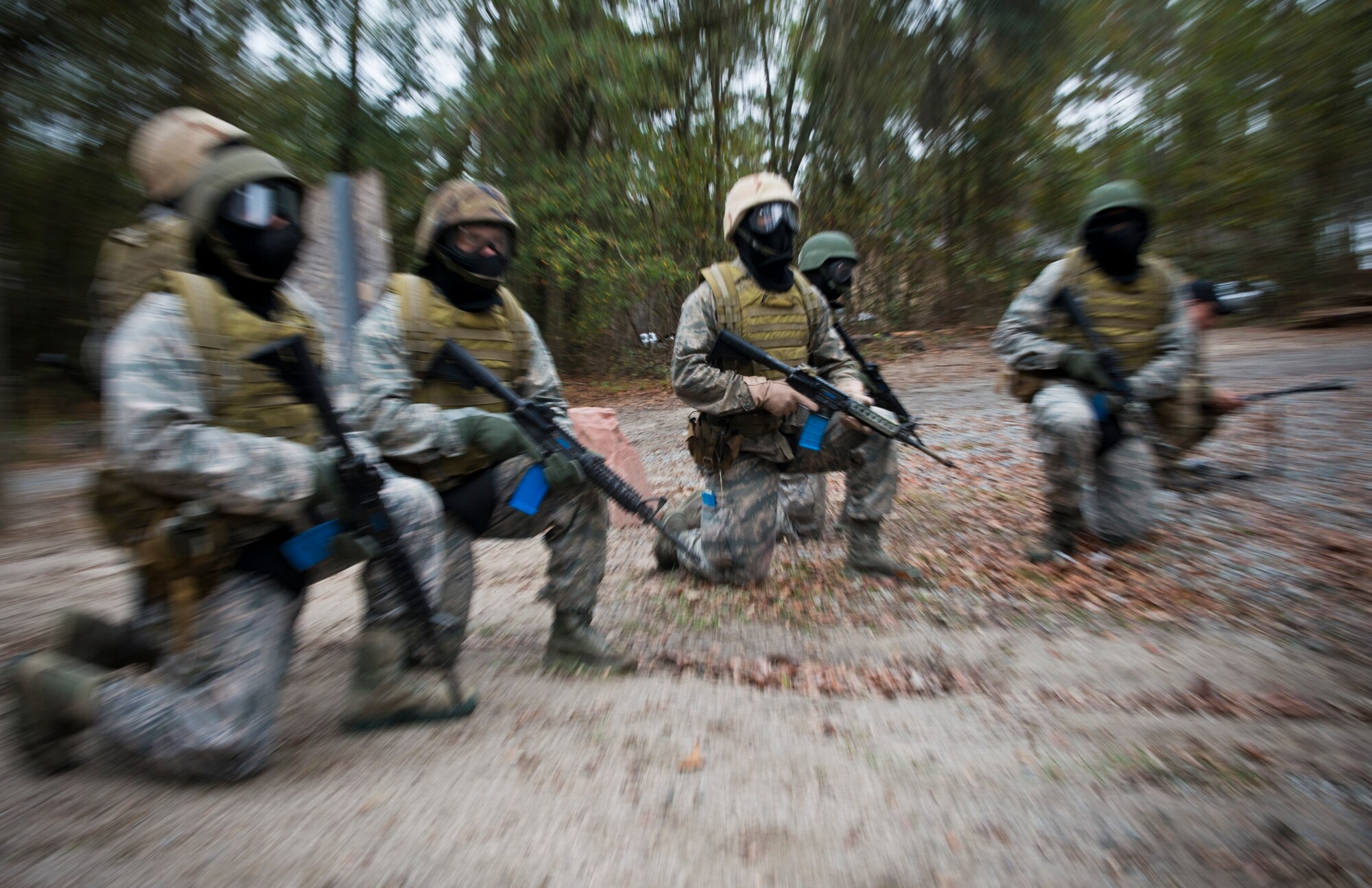 U.S. Air Force ROTC Cadets from multiple universities including Louisiana State University, University of Nevada, Las Vegas and the University of Oklahoma, take a knee before they begin an Air Liaison Officer Aptitude Assessment course at Moody Air Force Base, Ga., Dec. 13, 2012. The assessment is a mandatory course for candidates who want to become ALOs. (U.S. Air Force photo by Senior Airman Douglas Ellis/Released)

