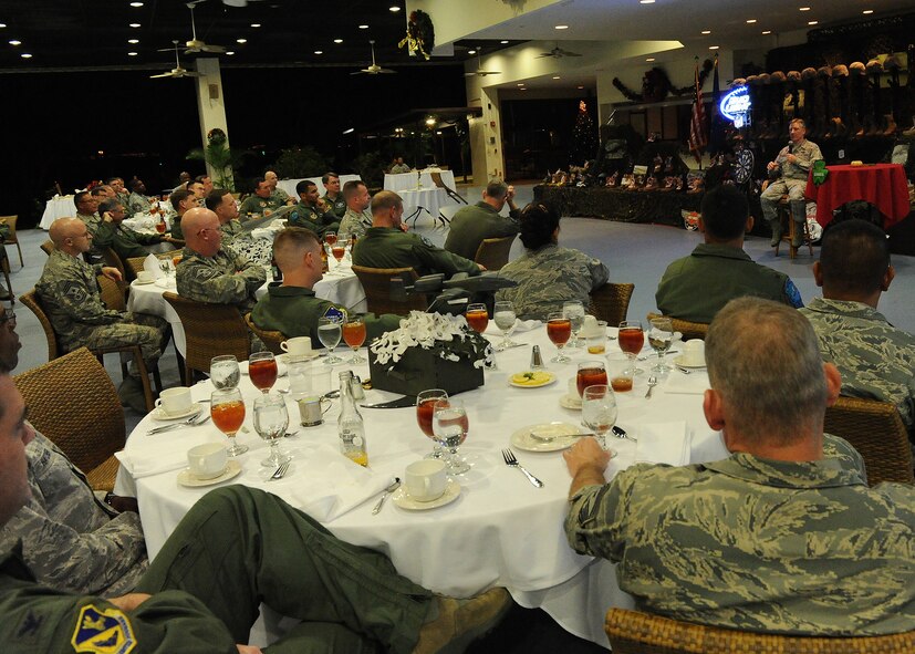 Gen. Herbert “Hawk” Carlisle, Pacific Air Forces commander, shares a story of an American hero who died in defense of the U.S. with members of his staff during the 2012 PACAF Commanders and Command Chiefs Warfighter Conference dinner at the Hickam Officers’ Club, Joint Base Pearl Harbor-Hickam, Hawaii, Dec. 12, 2012. This year’s conference theme paid homage to modern-day heroes.  (U.S. Air Force photo/Tech. Sgt. Jerome S. Tayborn)