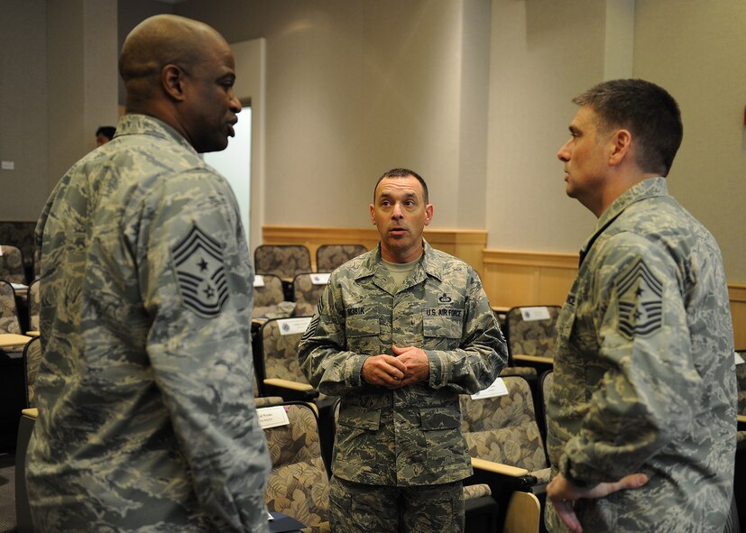 Left to right, Chief Master Sgt. Jerry Moore, 354th Fighter Wing command chief; Chief Master Sgt. James. E. Slisik, 36th Wing command chief; and Chief Master Sgt. Scott Delveau, 7th Air Force command chief, discuss Pacific Air Force’s strategy during the 2012 PACAF Commanders and Command Chiefs Warfighter Conference at the Aloha Conference Center, Joint Base Pearl Harbor-Hickam, Hawaii, Dec. 11, 2012.  The event is an annual conference focused on addressing issues and challenges facing the command. (U.S. Air Force photo/Tech. Sgt. Jerome S. Tayborn)