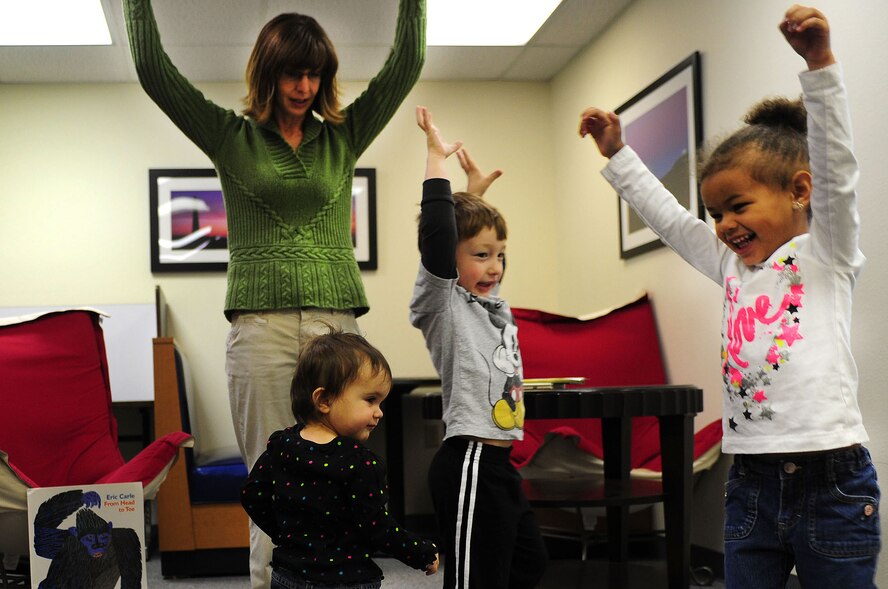 Children dance during Toddler Time at the Base Library at Cannon Air Force Base, N.M, Dec. 12, 2012. Toddler Time is a monthly program that consists of stories and activities for children ages three and younger. (U.S. Air Force photo/Airman 1st Class Ericka Engblom)