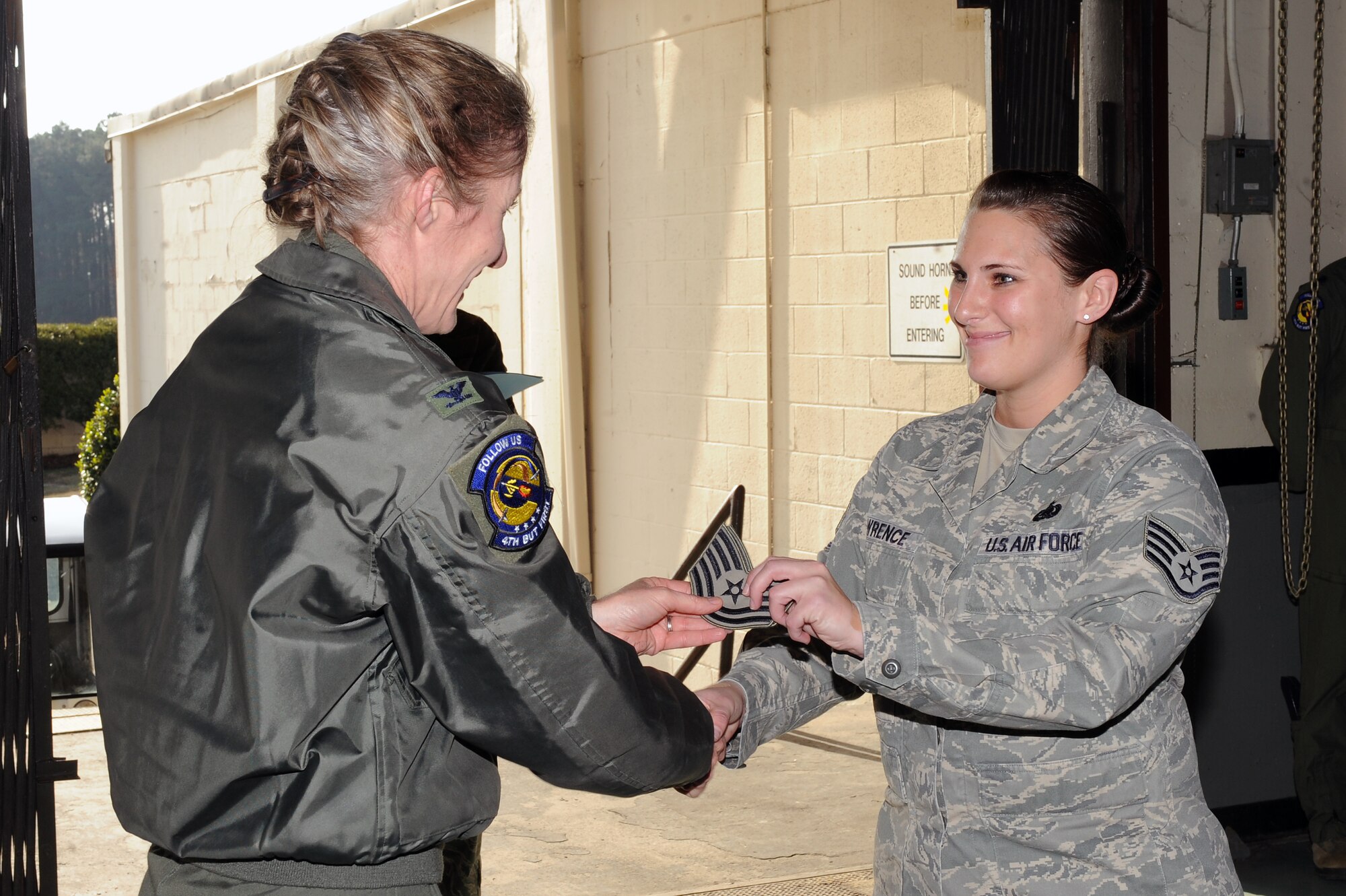 U.S. Air Force Col. Jeannie Leavitt, 4th Fighter Wing commander, promotes Staff Sgt. Rebecca Lawrence, 4th Logistics Readiness Squadron logistics planner, to the rank of technical sergeant through the Stripes for Exceptional Performers program on Seymour Johnson Air Force Base, N.C., Dec. 13, 2012. Lawrence was named Superior Performer for the 2012 Logistics Compliance Assessment Program. (U.S. Air Force photo/Airman 1st Class John Nieves Camacho/Released)