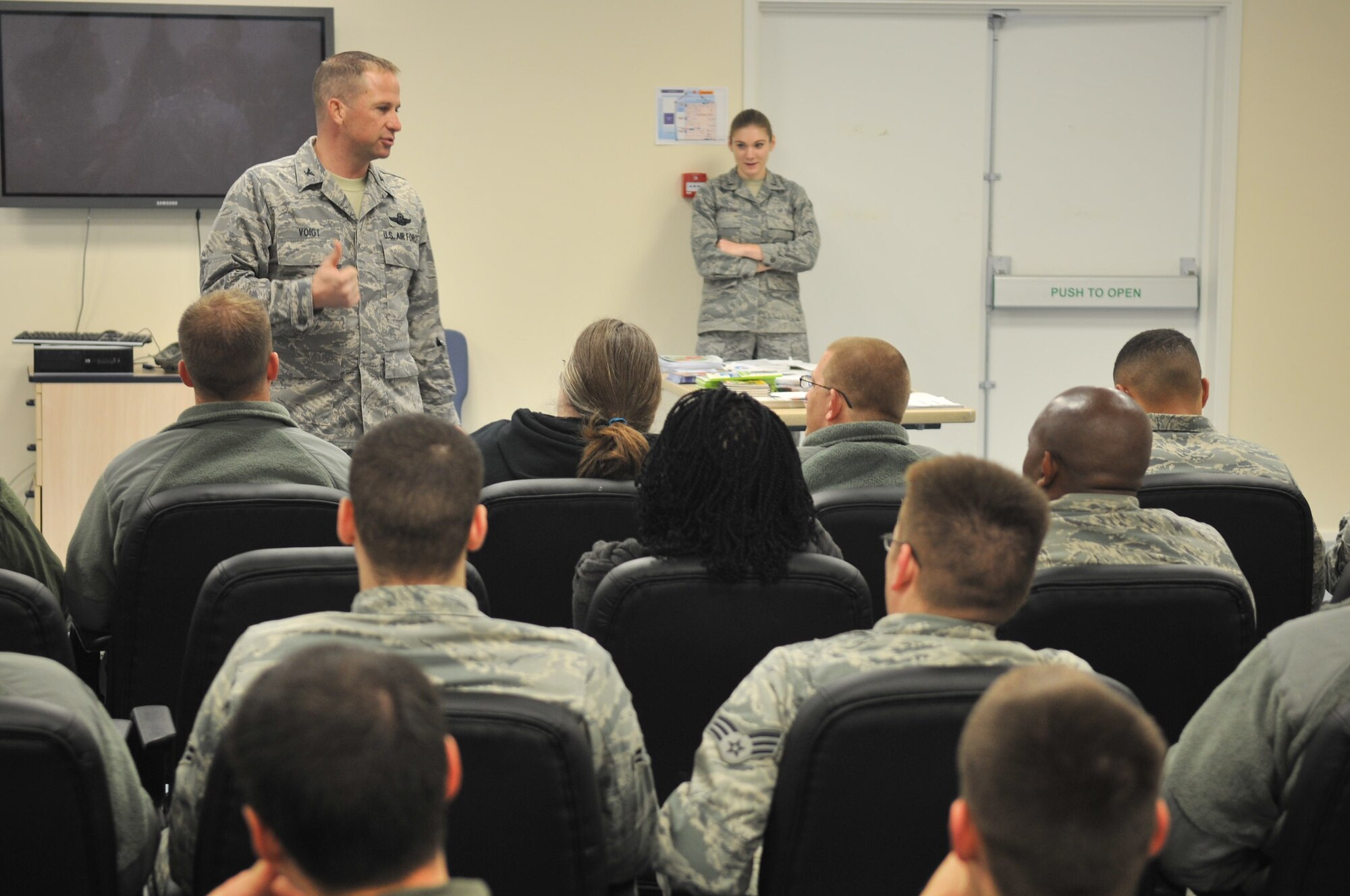 Col. Kyle Voigt, 100th Air Refueling Wing vice commander, addresses Airmen Dec. 17, 2012, at RAF Mildenhall, England, for a reintegration briefing. The Airmen were deployed for about three months in support of operations at an undisclosed location. (U.S. Air Force photo by Airman 1st Class Dillon Johnston/Released)