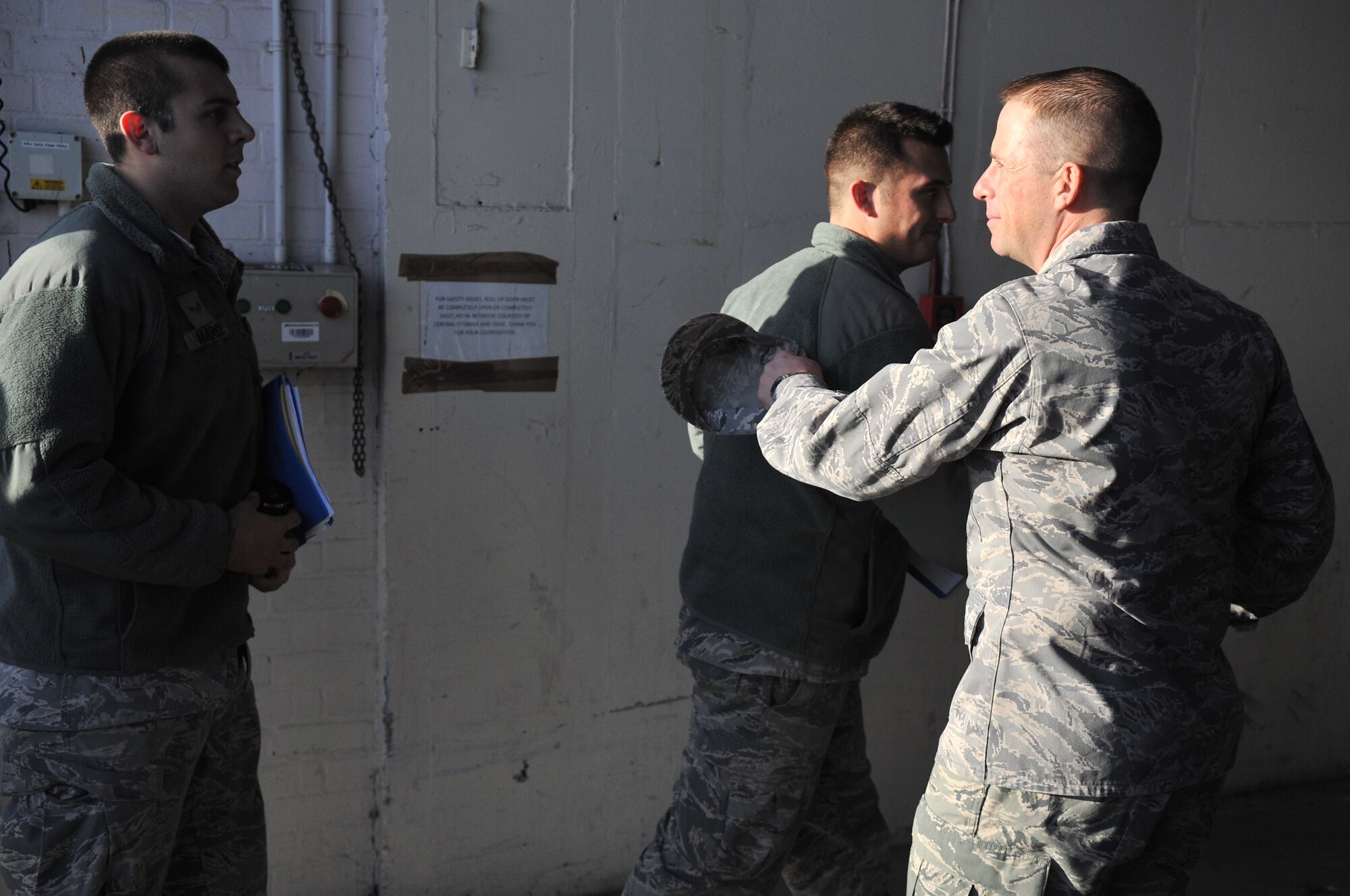 Col. Kyle Voigt, 100th Air Refueling Wing vice commander, greets Airmen Dec. 17, 2012, at RAF Mildenhall, England, as they return from a deployment. The Airmen were deployed to an undisclosed location in support of operations. (U.S. Air Force photo by Airman 1st Class Dillon Johnston/Released)
