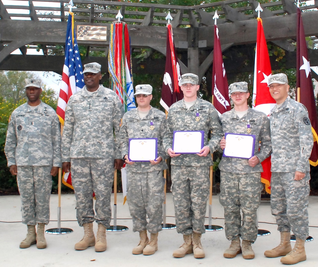 Photo by Robert Shields
(From left) Southern Regional Medical Command and Brooke Army Medical Center Command Sgt. Maj. Marshall Huffman, Army Vice Chief of Staff Gen. Lloyd J. Austin III, Spc. Marcus Carr, Pfc. Ryan Thomas, Spc. Christopher Delaney, and BAMC and SRMC Commander Maj. Gen. M. Ted Wong after the Purple Heart ceremony at the Warrior and Family Support Center Dec. 3. Austin awarded the Purple Heart medals and certificates to the recipients.
