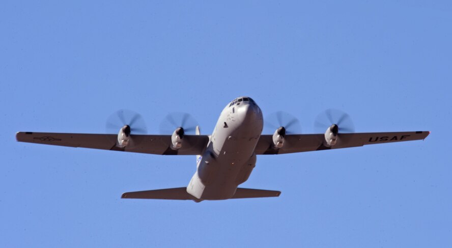 The newest C-130J flies over the flightline Dec. 13, 2012, at Dyess Air Force Base, Texas.  The aircraft was delivered by Maj. Gen. William J. Bender, U.S. Air Force Expeditionary Center commander, and is the 24th of 28 to be delivered to Dyess by 2013, replacing the legacy fleet of C-130Hs. Once the final aircraft is delivered, Dyess will be home to the largest C-130J fleet in the world. (U.S. Air Force photo by Airman 1st Class Peter Thompson/Released) 