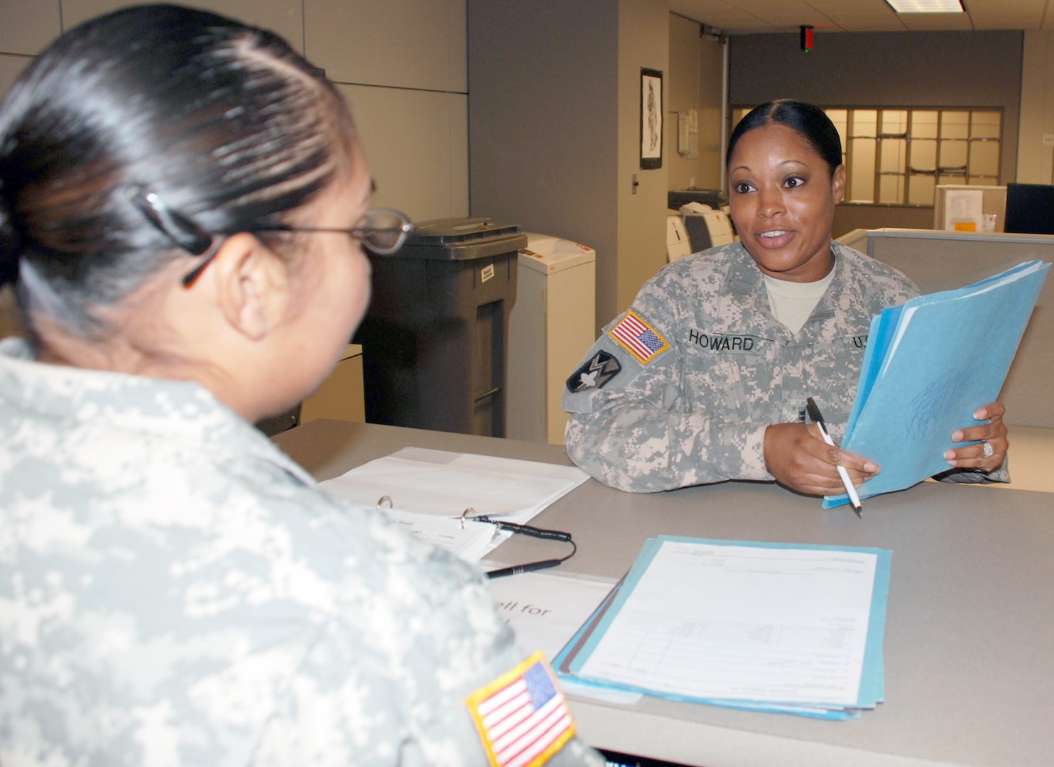 Photo by Gregory Ripps
Chief Warrant Officer 3 Christina Howard assists a customer at the S1 (Personnel) office of the 470th Military Intelligence Brigade.