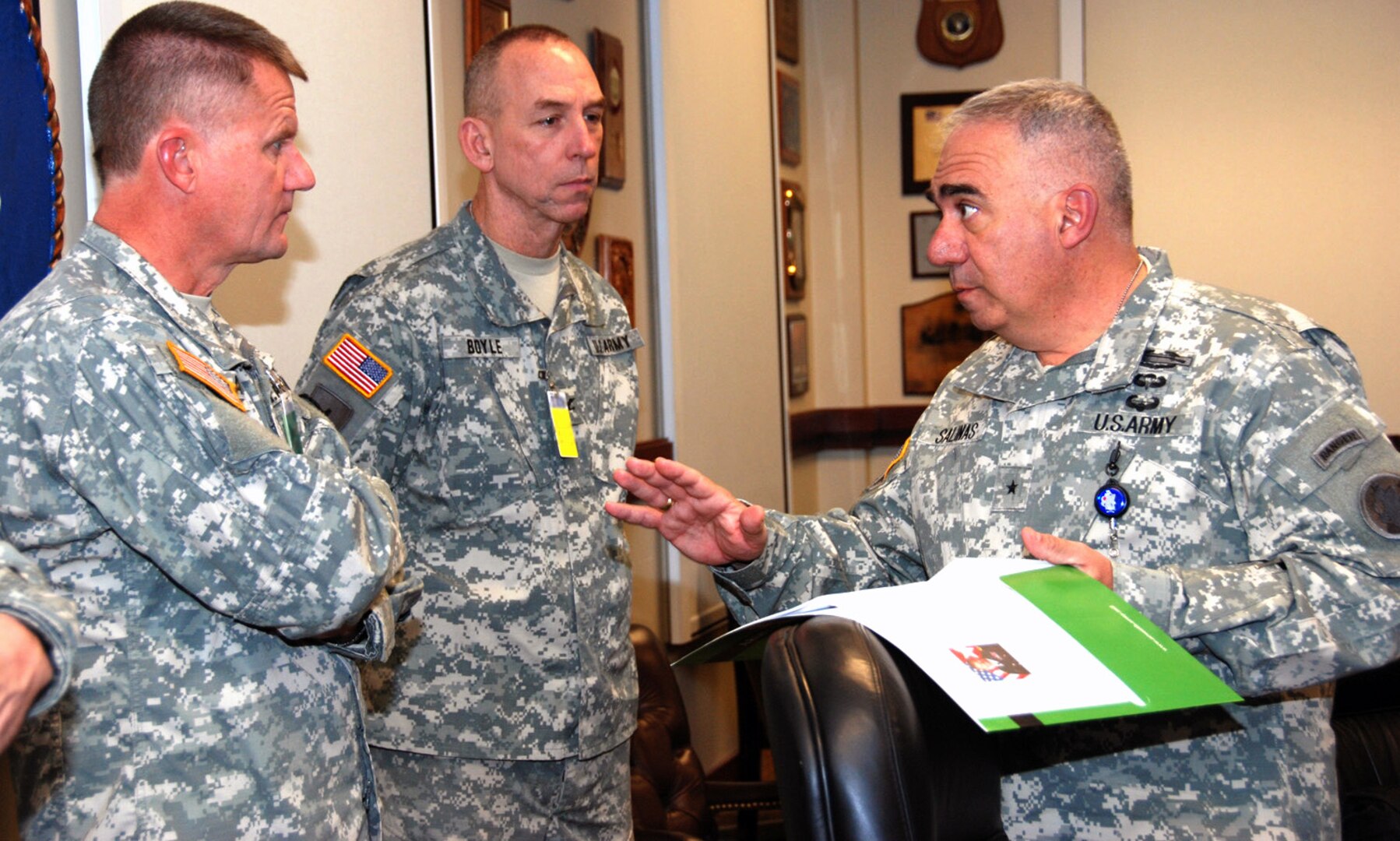 Photo by Robert R. Ramon
Brig. Gen. Orlando Salinas (right), U.S. Army South deputy commanding general, speaks to Col. David Boyle (center), Missouri Army National Guard chief of staff and Brig. Gen. Randy Alewel (left), 35th Engineer Brigade commanding general, at the Army South headquarters.