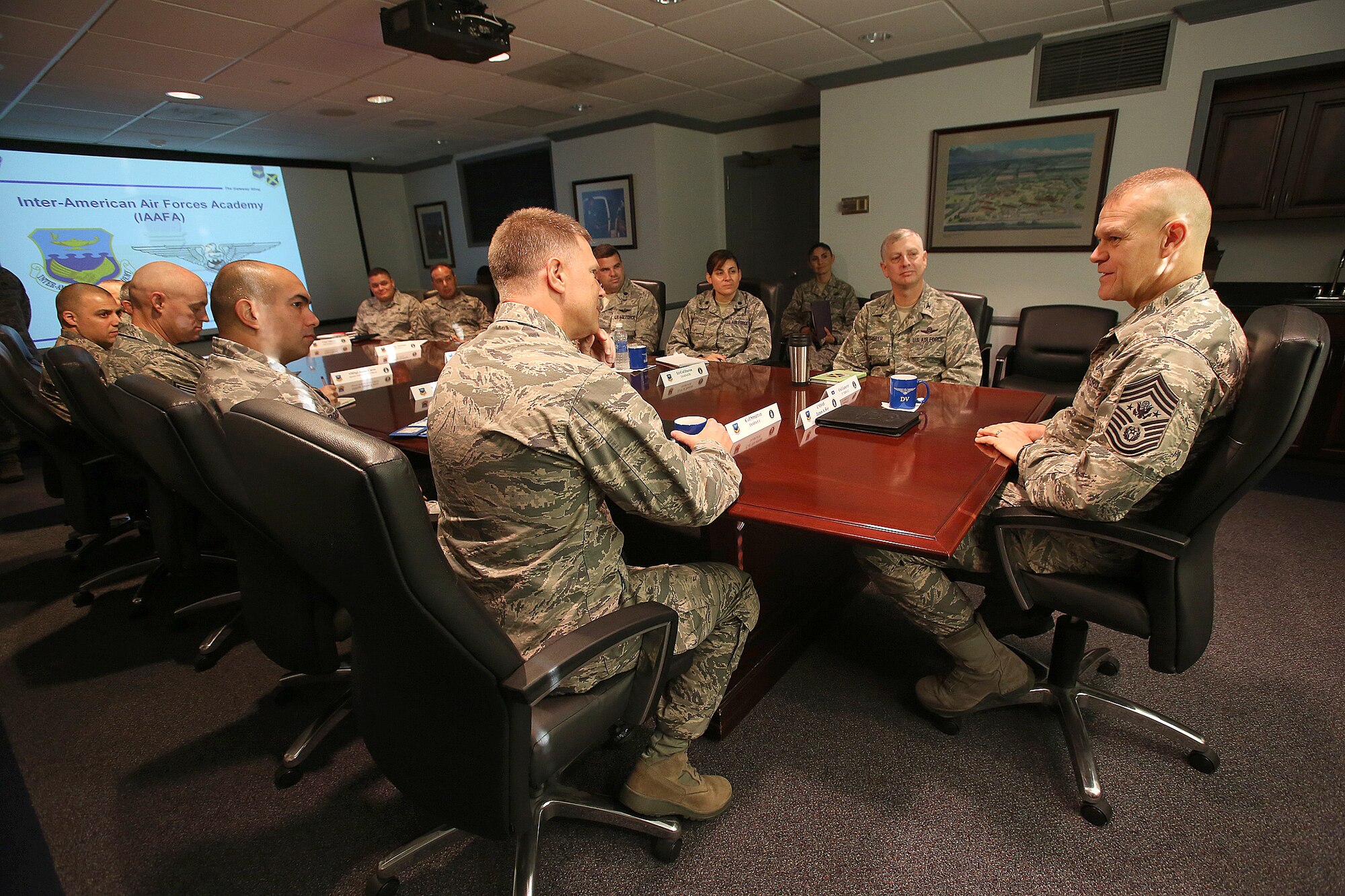 Colonel Marc F. Stratton IAAFA commandant (left) hosts a visit by Chief Master Sgt. of the Air Force James Roy to the Inter-American Air Forces Academy in Joint Base San Antonio-Lackland, TX, Oct. 30, 2012.  Also present was 37th Training Wing Commander Colonel Mark D. Camerer (right).  (Photo by Robin Creswell)