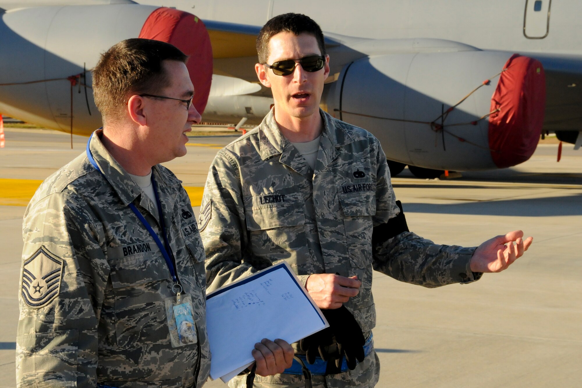 Staff Sgt. Jason LeChot (right), 911th Air Refueling Squadron, talks with an inspector general on the 916th Air Refueling Wing's ramp on Dec. 14, 2012. The 916th Air Refueling Wing underwent four major inspections between Dec. 11-18, 2012. (USAF photo by TSgt. Scotty Sweatt, 916ARW/PA)