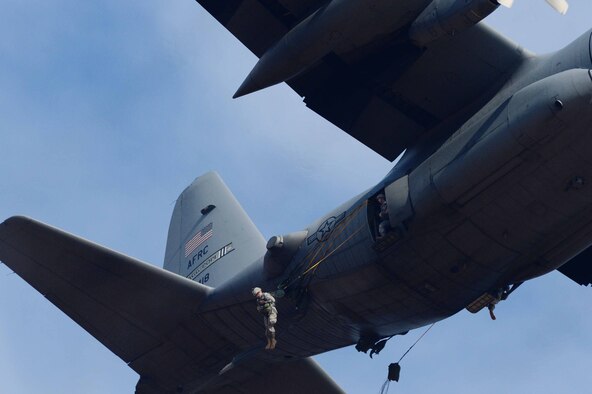 U.S. Army paratroopers descend from a U.S. Air Force C-130 Hercules during Operation Toy Drop 2012 at Fort Bragg, N.C., Dec. 8, 2012. 2012 marks the 15th year for the Randy Oler Memorial Operation Toy Drop which collects toy donations for children and families in need and gives paratroopers the opportunity to jump with foreign jumpmasters. Soldiers donate a new toy in exchange to jump with a foreign jumpmaster and earn foreign jump wings. This year, OTD has expanded from its traditional focus around Fort Bragg, N.C. to select cities around the country. OTD is a Fort Bragg airborne tradition. Operation Toy Drop combines thousands of toys, Army paratroopers, hundreds of volunteers, dozens of allied military personnel, and more than a dozen Air Force aircraft, all for what has become the world's largest combined airborne operation. (U.S. Air Force photo by Tech. Sgt. Barry A. Loo)
