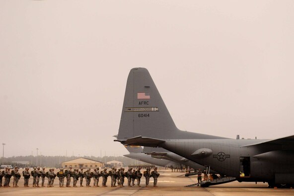 U.S. Army Soldiers from  Ft. Bragg board a  C-130 Hercules during Operation Toy Drop at Pope Army Air Field, N.C., December 8, 2012. 2012 marks the 15th year for the Randy Oler Memorial Operation Toy Drop which collects toy donations for children and families in need and gives paratroopers the opportunity to jump with foreign jumpmasters. Soldiers donate a new toy in exchange to jump with a foreign jumpmaster and earn foreign jump wings. This year, OTD has expanded from its traditional focus around Fort Bragg, NC to select cities around the country. OTD is a Fort Bragg airborne tradition. Operation Toy Drop combines thousands of toys, Army paratroopers, hundreds of volunteers, dozens of allied military personnel, and more than a dozen Air Force aircraft, all for what has become the world's largest combined airborne operation.  (U.S. Air Force photo by Senior Airman James Richardson)