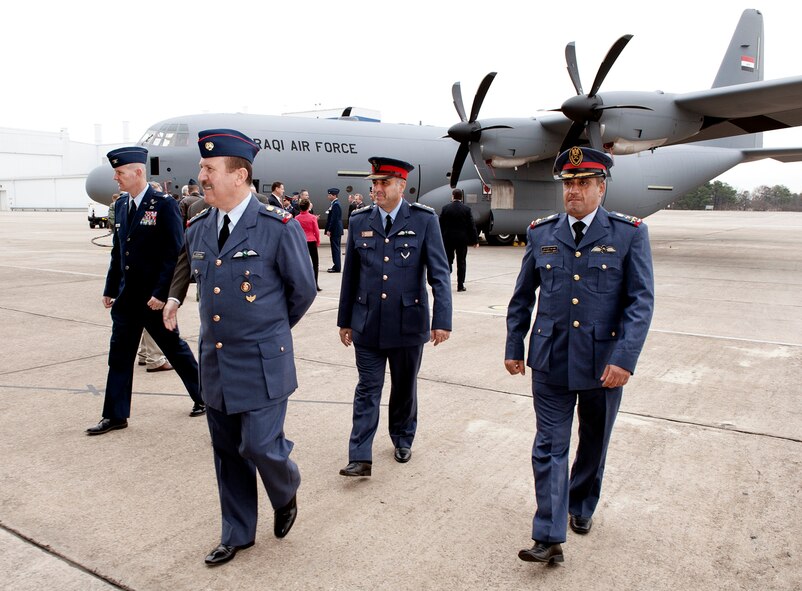 Staff Lt. Gen. Anwer Hamad Amen, Iraqi Air Force Commander, and his staff walk towards the Lockhead Martin facility after looking at the C-130J that will be delivered from Marietta, GA as the first three to Iraq Dec. 12, 2012. (Courtesy photo by Lockhead Martin’s John Rossino)
